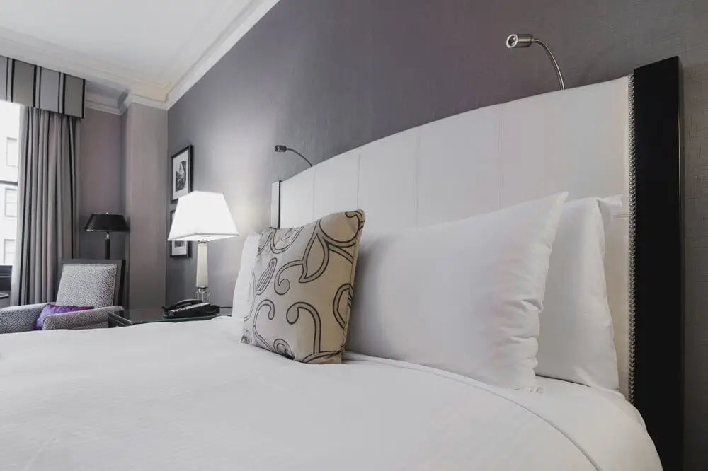 Bed in bright hotel room