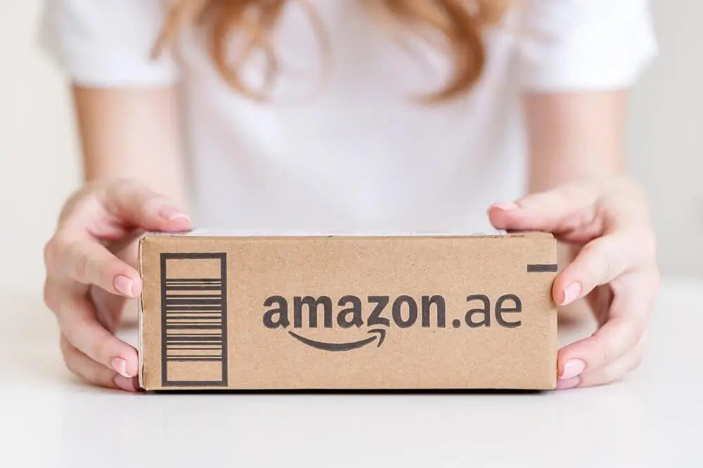 Female holding box from Amazon UAE