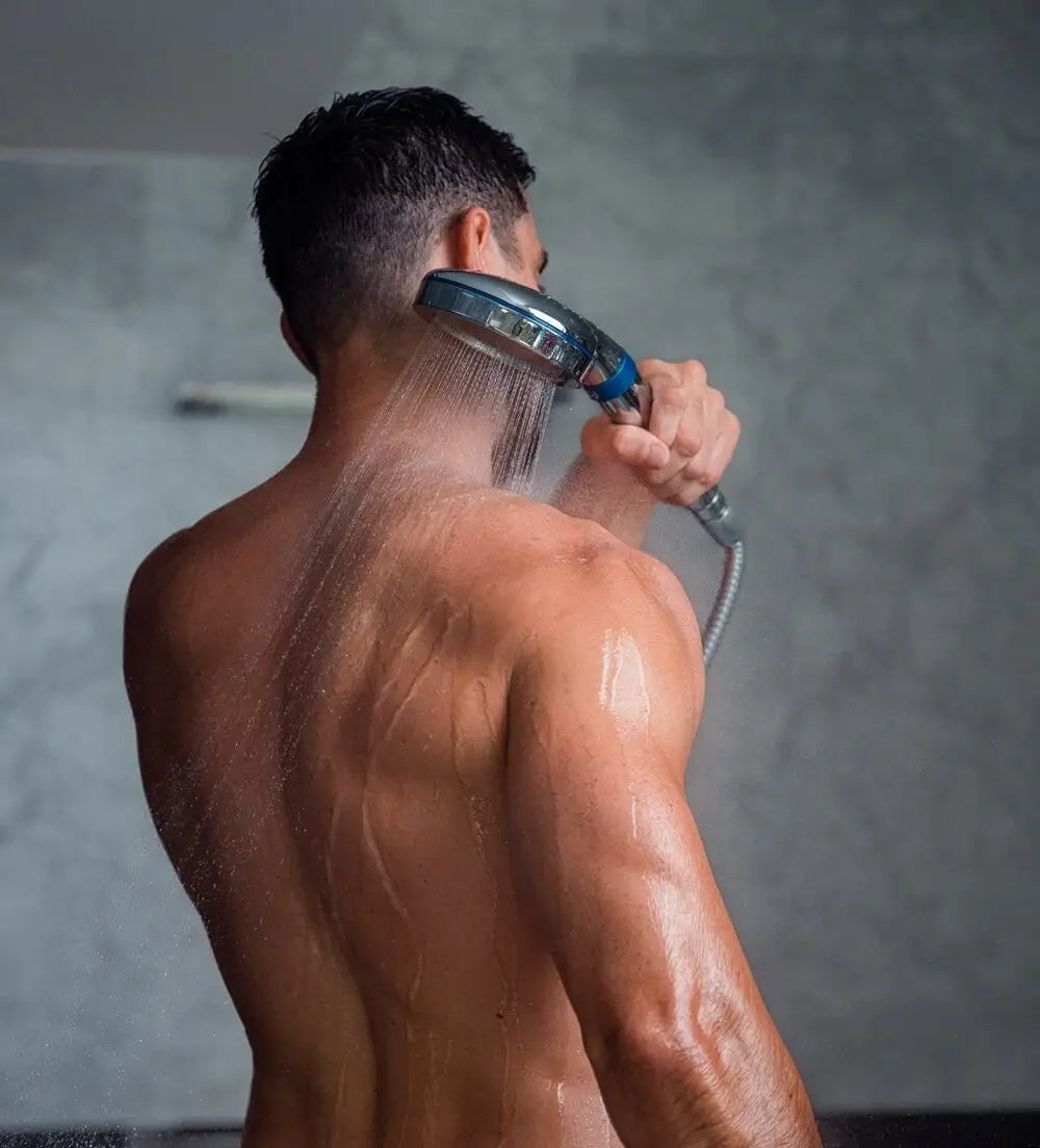 Male washing back with the blu Ionic Shower Filter Handheld